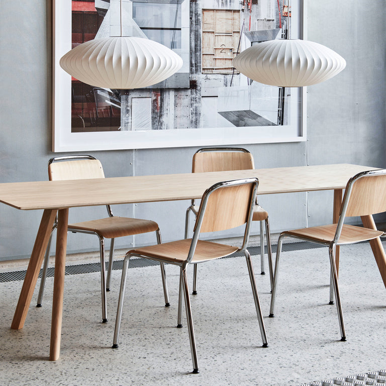 Nelson Saucer Bubble Pendant Over Copenhague Table Hay